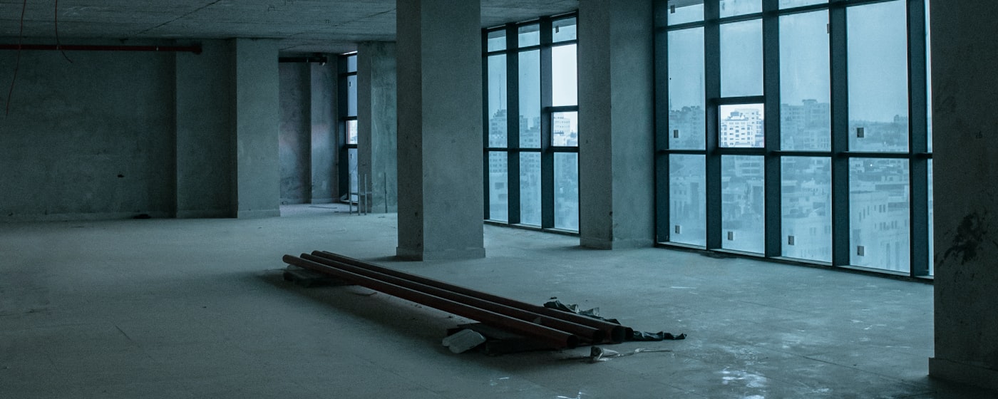Unfinished commercial interior after construction, before final clean-up